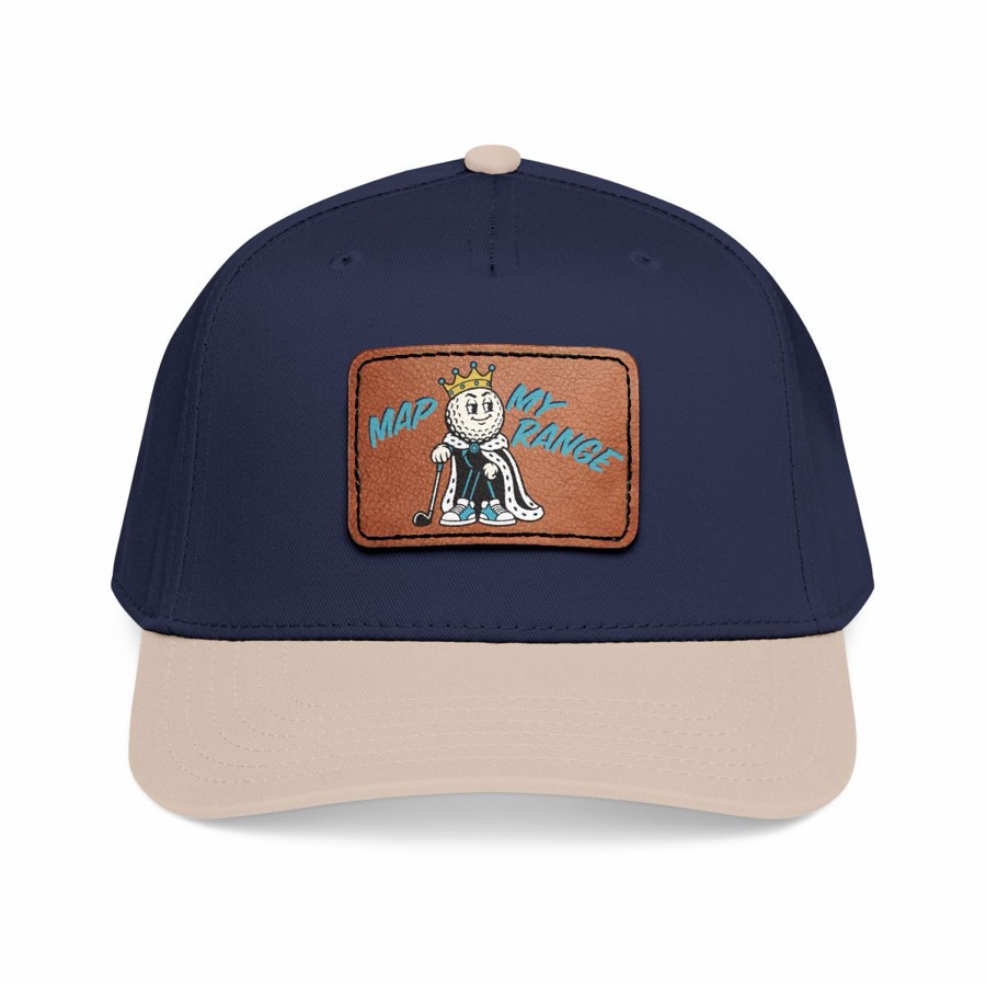 Navy six-panel cap with a tan brim and a leather patch